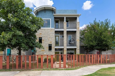 View of property featuring a fenced front yard