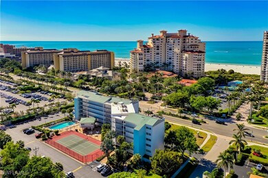 Aerial view of extended coastline and apartment complex