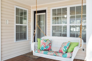 Wooden deck featuring a porch