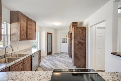 Large kitchen with nice pantry and room for a tabl