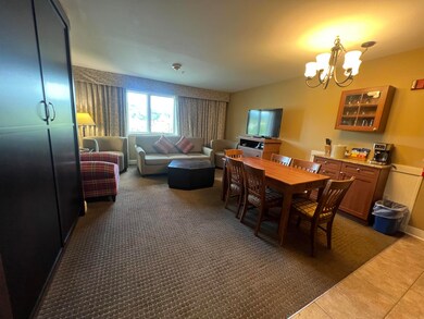 Closed Murphy bed on left.