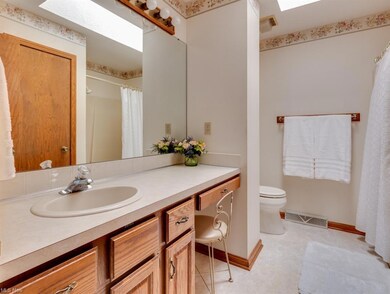 This full, shared bath has lots of storage and cou