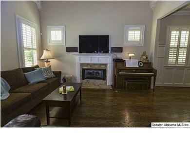 Plenty of natural light and a tile fireplace
