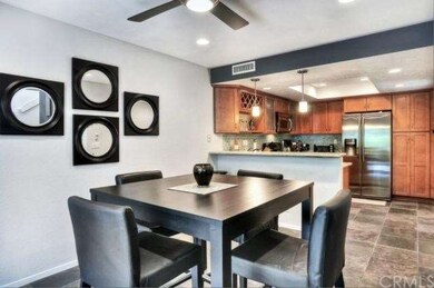 Dining area with open kitchen.