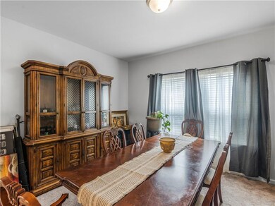 Dining space featuring light colored carpet