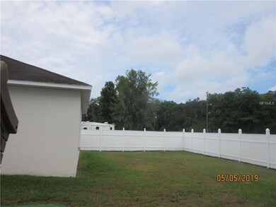 Backyard with PVC fence made to take down and use 