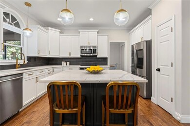 New quartz counters, lighting, backsplash