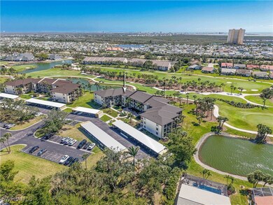 Bird's eye view with view of golf course and a wat
