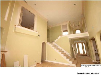 Balcony view above Family. Fireplace mantel will be floor to ceiling stone accent.