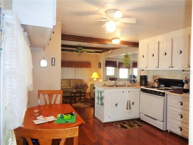 Eat-in Kitchen as Seen Coming in from the Carport Door * Gas for Cooking, Hot Water and Heat is Included in the Monthly Maintenance