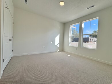 Unfurnished room with carpet floors and baseboards
