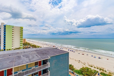View of water feature featuring a beach view