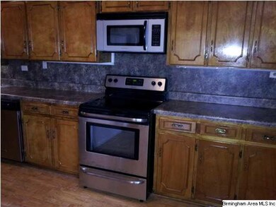 Kitchen has brand new stainless range and built in