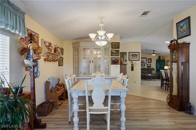 Dining space featuring ceiling fan with notable ch