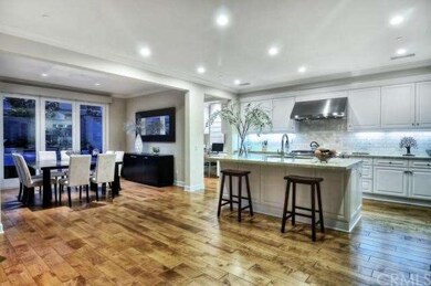 The spacious open floor plan highlights the Hardwo