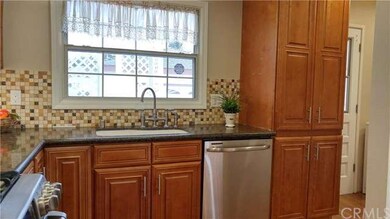 Kitchen to back yard and laundry room