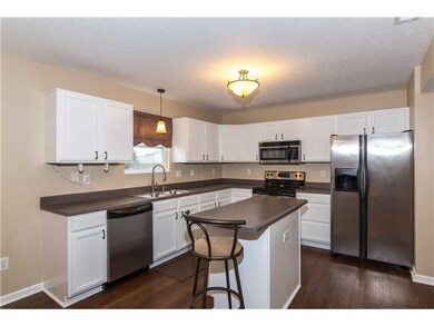 Kitchen. Stunning Kitchen w/ center island.  All appliances stay... and the seller is offering a 1-yr. homebuyer s warranty on the home.