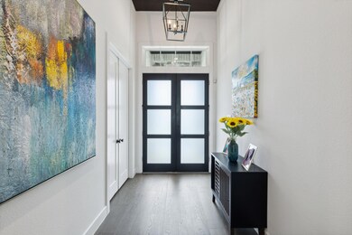 Entryway featuring wood finished floors, french do