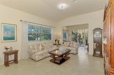 Living room affords a lot of space for entertaining and features a bright open floor plan.