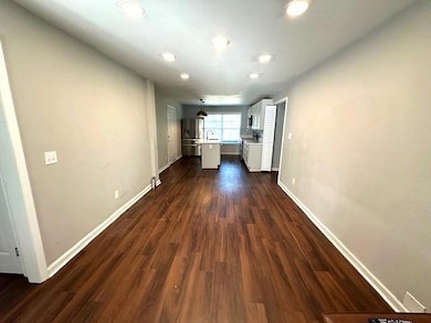 Hall featuring dark hardwood / wood-style floors a
