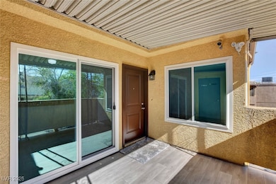 Entrance to property featuring stucco siding