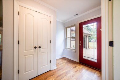 Foyer opens up to kitchen and living area with soa