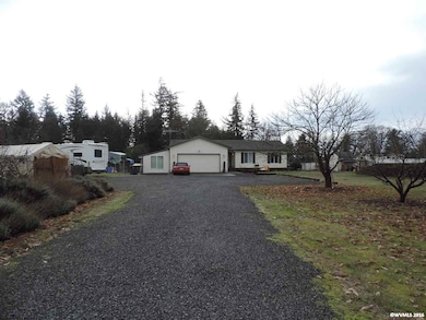 lots of trees welcome you into this home set off t