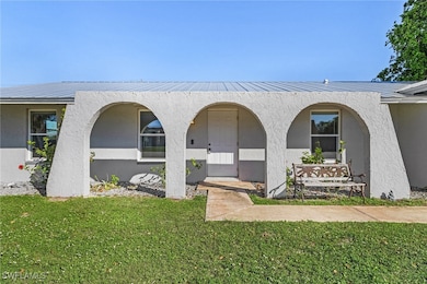 Property entrance featuring a lawn