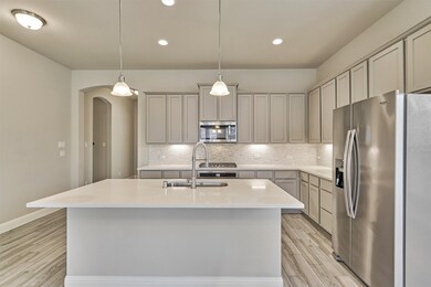 The island/breakfast bar can seat four.