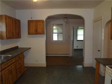 Kitchen. A full View of Kitchen into Den into Fami