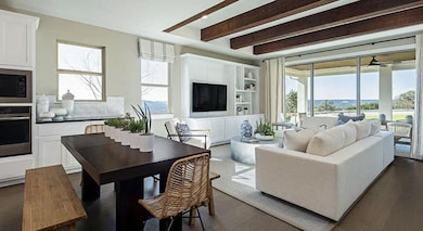 Living area with beamed ceiling, plenty of natura