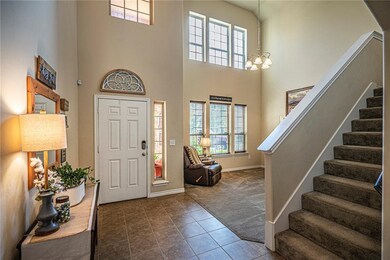 Light and Bright front living area with soaring 20