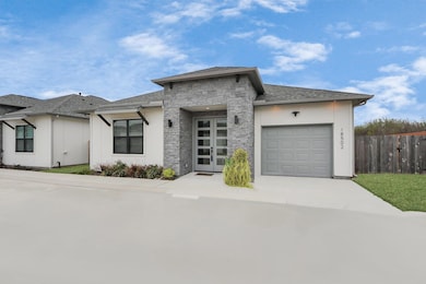 This contemporary single-story home boasts a clean