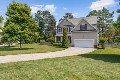 View of front of house with driveway and a garage
