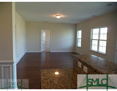Living Room. Kitchen opens into family room