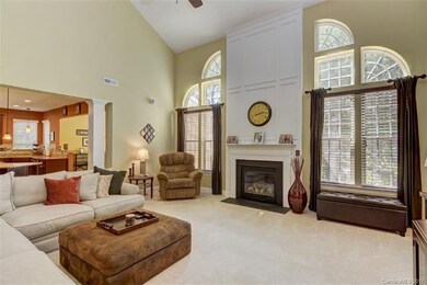 Great room with elegant windows overlooking the na