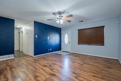 Unfurnished room with dark hardwood / wood-style f