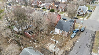 Aerial overview of property's location featuring nearby suburban area