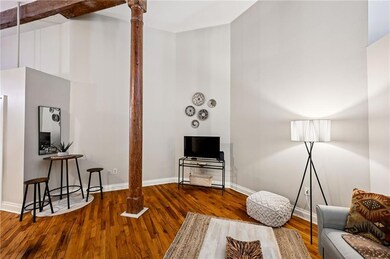 Those original wood floors and wood beams give tex