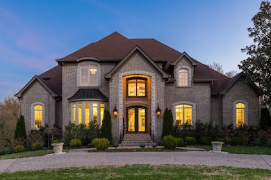 Day or night this property shines with its exquisite entry and timeless design.