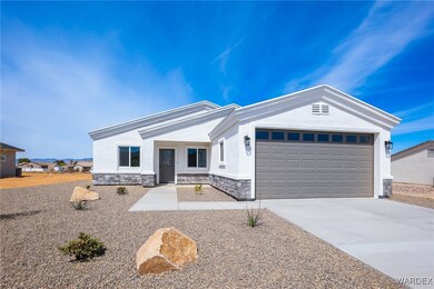 Single story home featuring stucco siding, drivewa