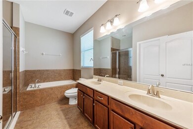 Master bath showcasing DUAL SINKS, GARDEN TUB, and