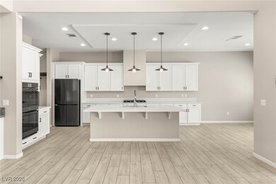Kitchen with custom lighting, quartz countertops,