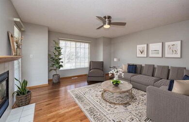 Living Room w/ fireplace and large windows