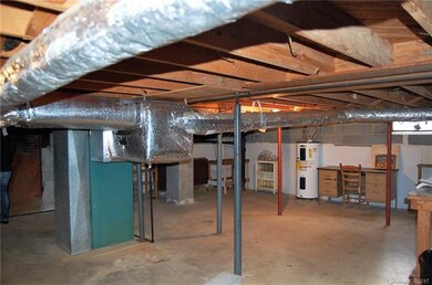 UNFINISHED BASEMENT WITH PARTIAL CONCRETE FLOOR, E