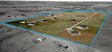 Birds eye view of property with a rural view