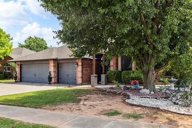 View of front facade featuring brick siding, a garage, concrete driveway, and a shingled roof