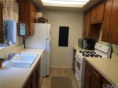 Kitchen with refrigerator and dishwasher 