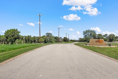 Birds eye view of property with a water view and a