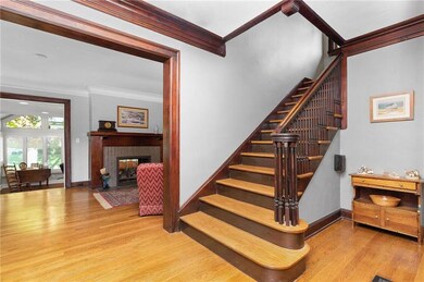 Foyer opens into living room on left and dining ro